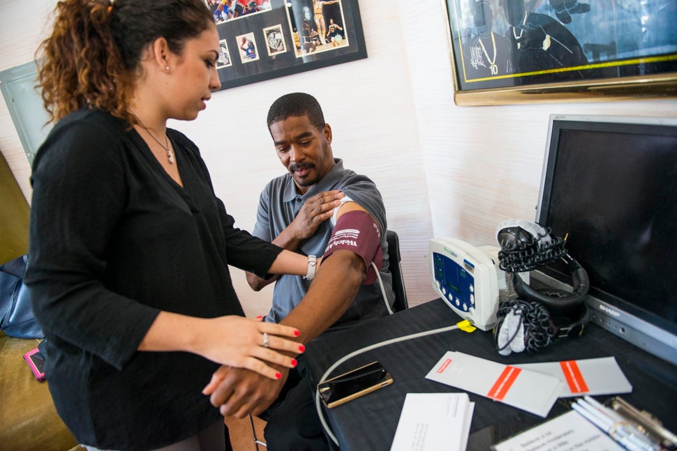 Ray Quick has his blood pressure taken by Natalia Martinez Lopez, a research coordinator with NYU School of Medicine.