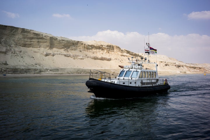 <p>Boats pass through the New Suez Canal in Ismailia, Egypt, on June 13, 2015.</p>