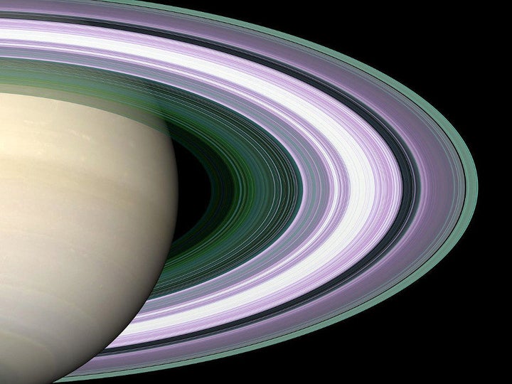 In this simulated image of Saturn's rings, color is used to present information about ring particle sizes in different regions. 