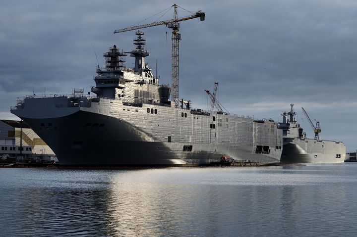 A picture shows the Sevastopol (L) and the Vladivostok warships, two Mistral class LHD amphibious vessels ordered by Russia from STX France in Saint-Nazaire, western France, on December 20, 2014. 