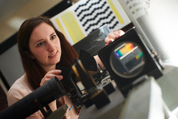 Lauren Welbourne with a colorimeter machine.