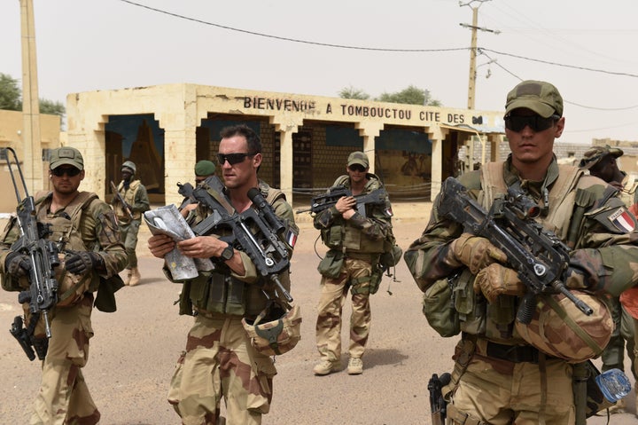 French and Malian soldiers patrol the streets in Timbuktu, Mali, on June 6, 2015.