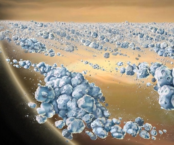 This is an artist concept of a close-up view of Saturn's ring particles. 