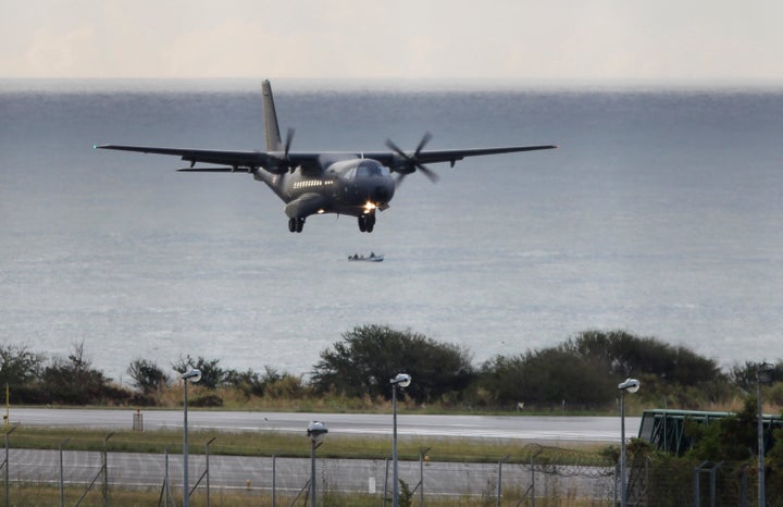 <p>A French Air Force plane taking part in the search for wreckage from the missing MH370 plane lands in Saint-Marie on the island of La Reunion on Aug. 7, 2015.</p>