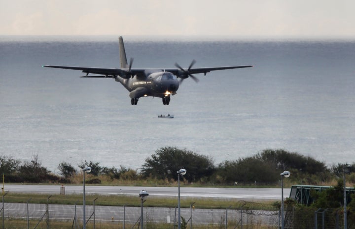 A French Air Force plane taking part in the search for wreckage from the missing MH370 plane lands in Saint-Marie on the island of La Reunion on Aug. 7, 2015.