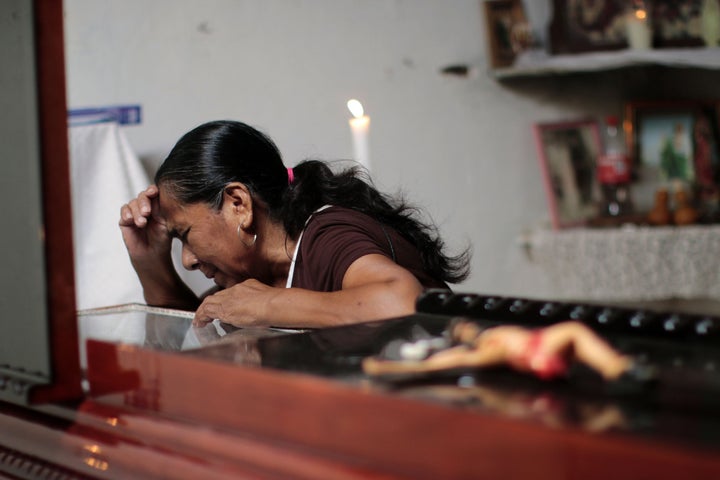 A woman attends the wake of Miguel Angel Jimenez Blanco in Guerrero state. 2015.