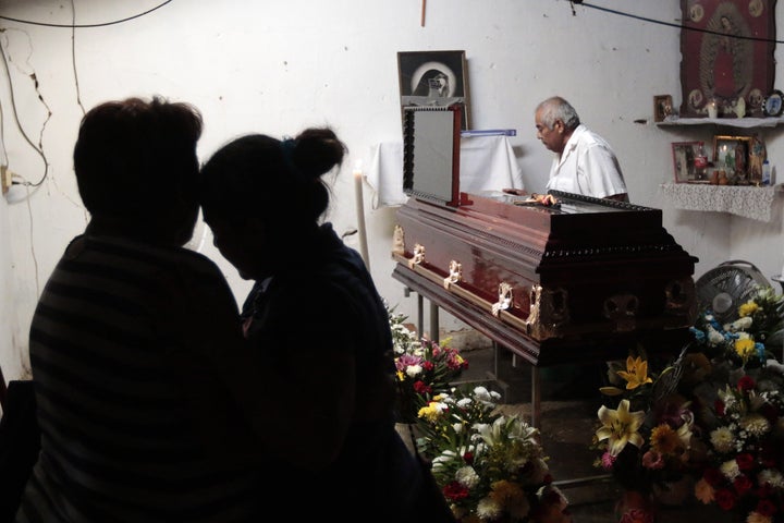 Relatives and friends attend the wake of Miguel Angel Jimenez Blanco in Guerrero state. 