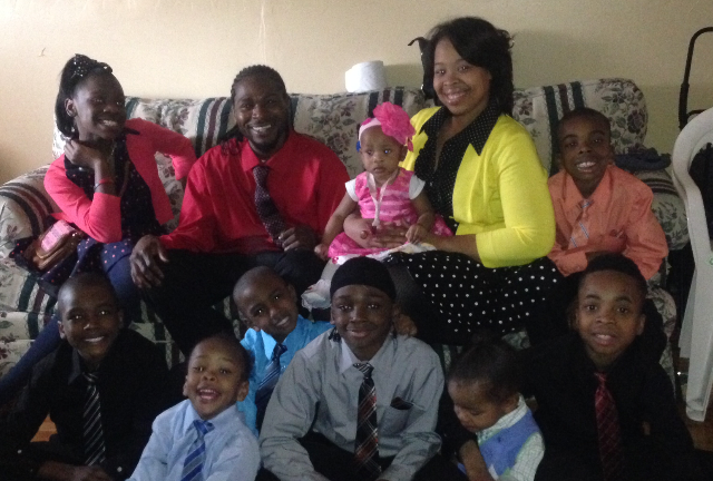 <p>Elaina Turner, Ulysses Green and their nine children.</p>