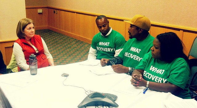 Fed Up activists meeting with Kansas City Fed President Esther George at the Kansas City Fed's 2014 symposium in Jackson Hole, Wyoming.