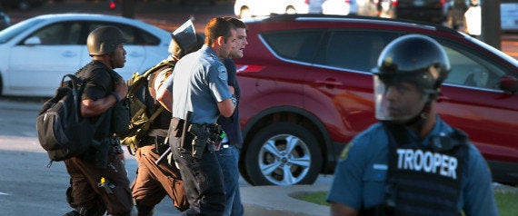 Huffington Post reporter Ryan Reilly is taken away by police during the unrest in Ferguson, Missouri, in August last year.