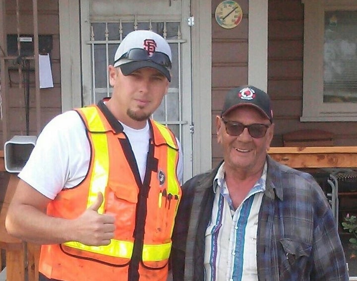 <p>Josh Cyganik (left) smiles with Leonard Bullock after a successful community drive to spruce up Bullock's house. </p>