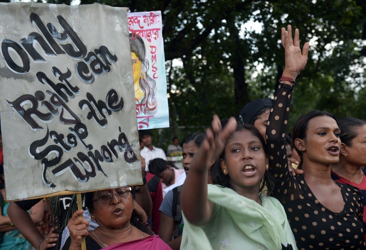 <p>Indian sex workers shout slogans as they participate in a rally in Kolkata on July 16, 2013. Amnesty International voted Tuesday to develop a policy on sex workers' rights.</p>