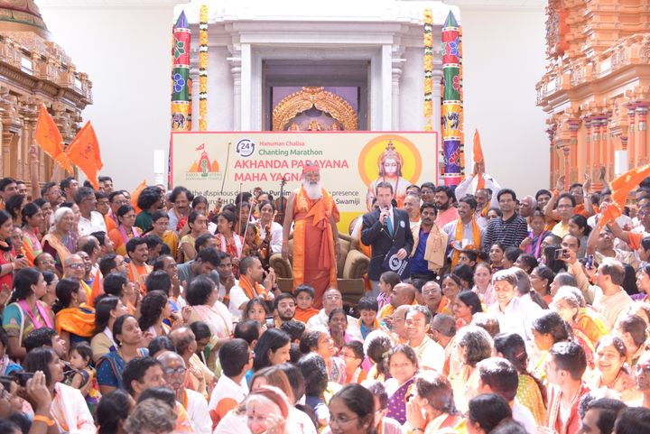 A Guinness World Record representative addresses the crowd at Hanuman Temple.