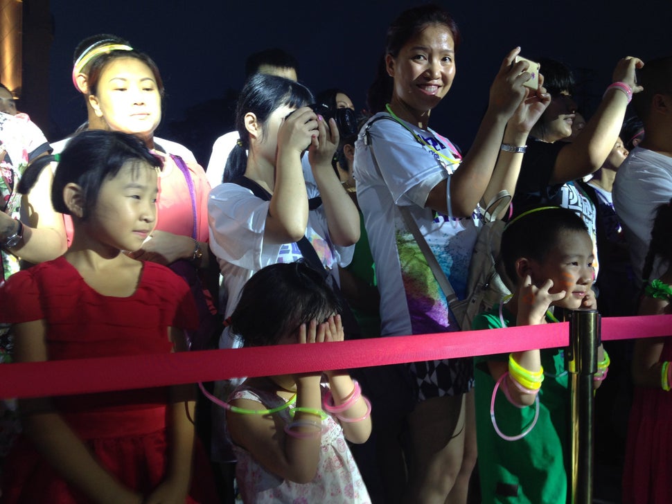 span /Fans of Fat Shady gather at a show marking the opening of the Golden Paris real estate development in Luzhou.