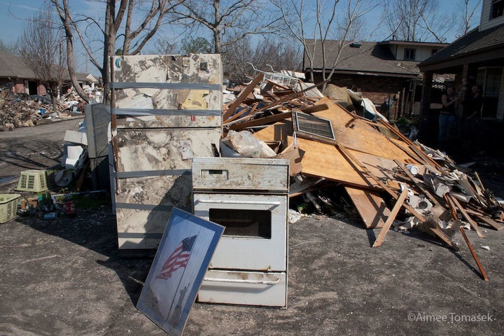 The early stages of a rubble pile outside the Reboul family home. After one week, piles would be as tall as a house. 