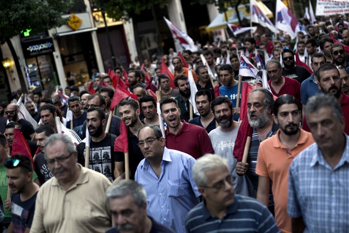 <p>Anti-austerity trade union members protest the new bailout deal in Athens.</p>