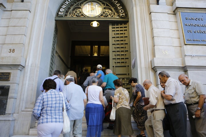 <p>The line outside an auxiliary branch of the Bank of Greece in Athens after capital controls were lifted.</p>
