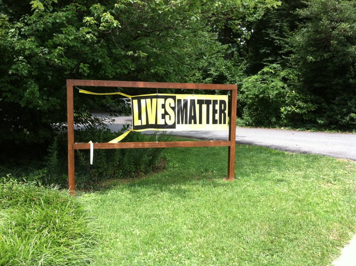 The original sign, shown here, was defaced on July 29.