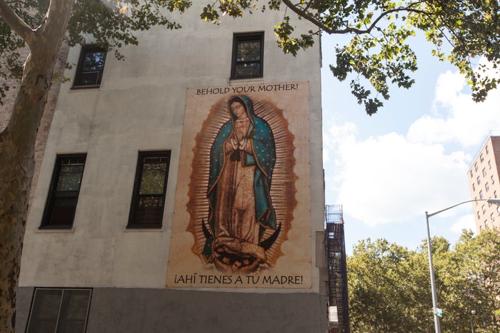 An image of Mary is posted on one of the walls of the Our Lady Queen of Angels complex.