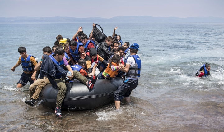 <p>Refugees arrive on the shores of the Greek island of Lesbos on June 2, 2015.</p>