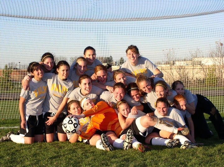 Bellware, far left, poses with her team.