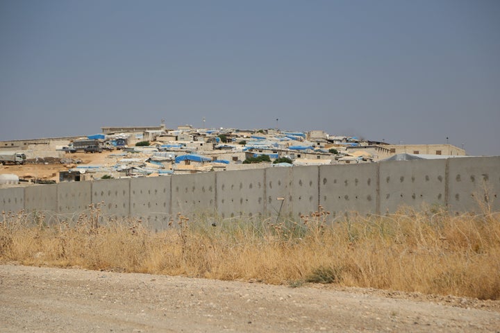 A 3-meter-high and 2-meter-wide wall sits along the Turkish-Syrian border on Aug. 13, 2015, as taken from Hatay, Turkey.