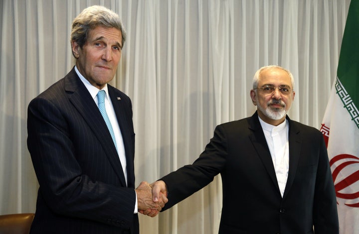 span /Iranian Foreign Minister Mohammad Javad Zarif shakes hands with Secretary of State John Kerry in Geneva on Ja
