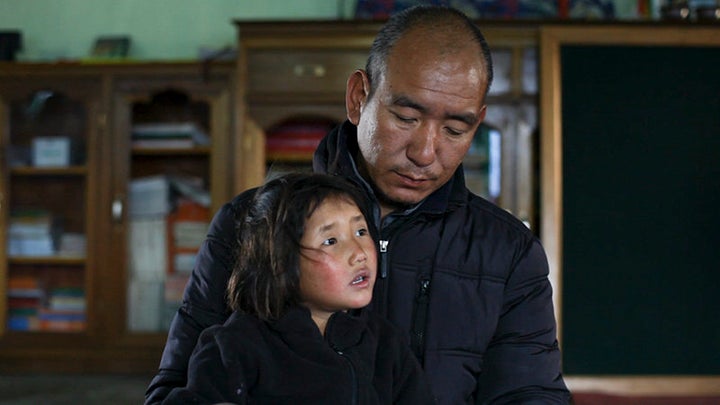 <span>Buddhist monk Phuntsok Lobsang with 5-year-old Tashi in the documentary “Tashi and the Monk,” co-directed b