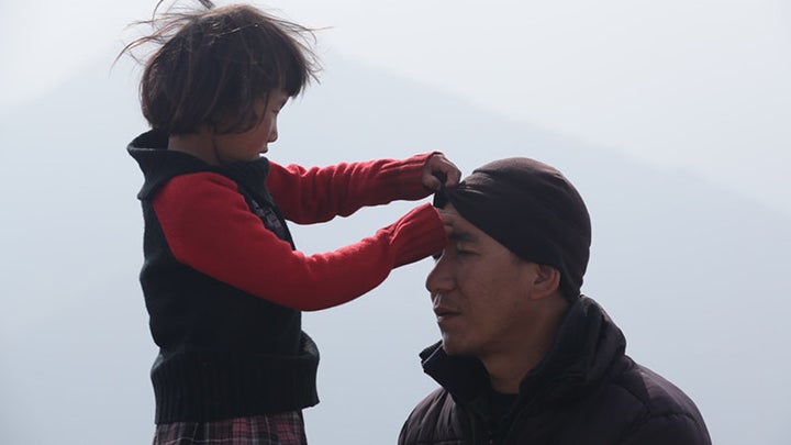 <span>Buddhist monk Phuntsok Lobsang with 5-year-old Tashi in the documentary “Tashi and the Monk,” co-directed b