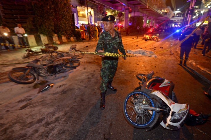 A Thai soldier cordons off an area around the blast site in Bangkok.