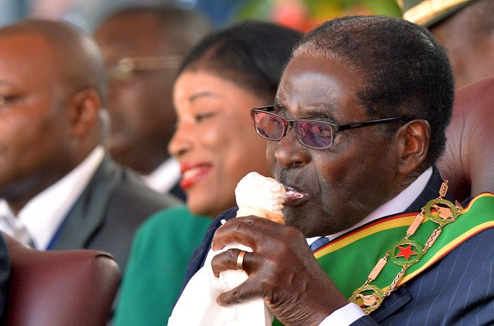 Zimbabwe President Robert Mugabe enjoys an ice cream cone.