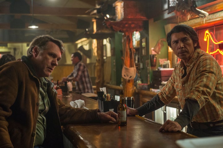 <span>Walt and Henry Standing Bear (Lou Diamond Phillips) meet up at Henry's bar, the Red Pony.</span>