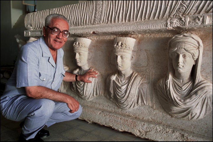 <p>Khaled al-Asaad, the Director of Antiquities and Museum in Palmyra, Syria, in front of a rare sarcophagus, Sept. 1, 2002. </p>