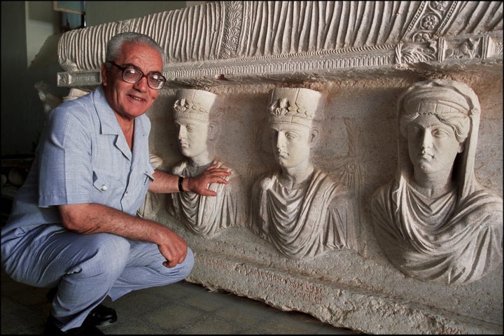 Khaled al-Asaad, the Director of Antiquities and Museum in Palmyra, Syria, in front of a rare sarcophagus, Sept. 1, 2002. 