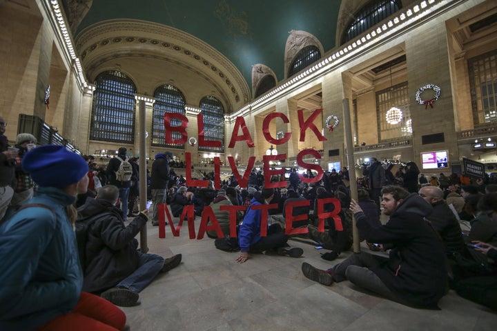 <p>Black Lives Matter protesters gather inside Grand Central Terminal in Manhattan on Dec. 7, 2014.</p>