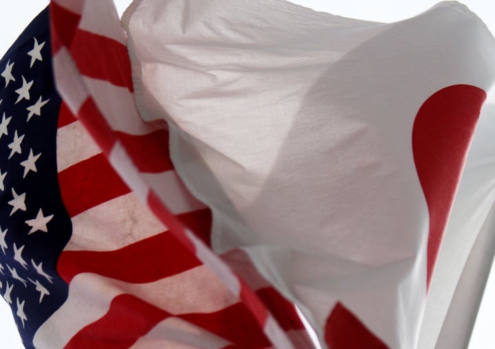 Japanese and U.S. flags fly in Tokyo, Japan.