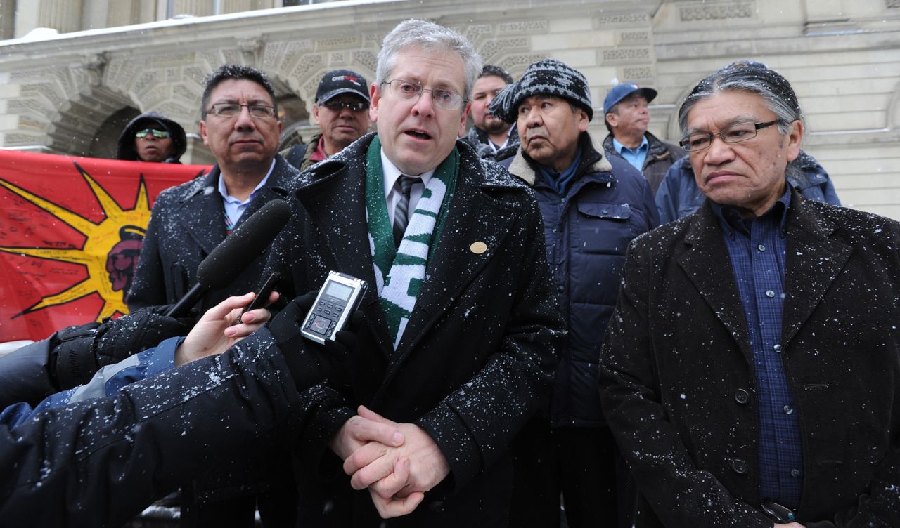 MP Charlie Angus stands with Alvin Fiddler, deputy grand chief of the Nishnawbe Aski Nation, prior to challenging a federal decision to suppress police and court evidence of abuse against children at the St. Anne's Residential School in 2013.