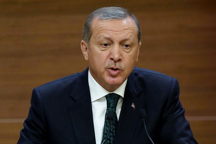 Turkish President Recep Tayyip Erdogan addresses a meeting at the presidential palace in Ankara on August 12, 2015. 