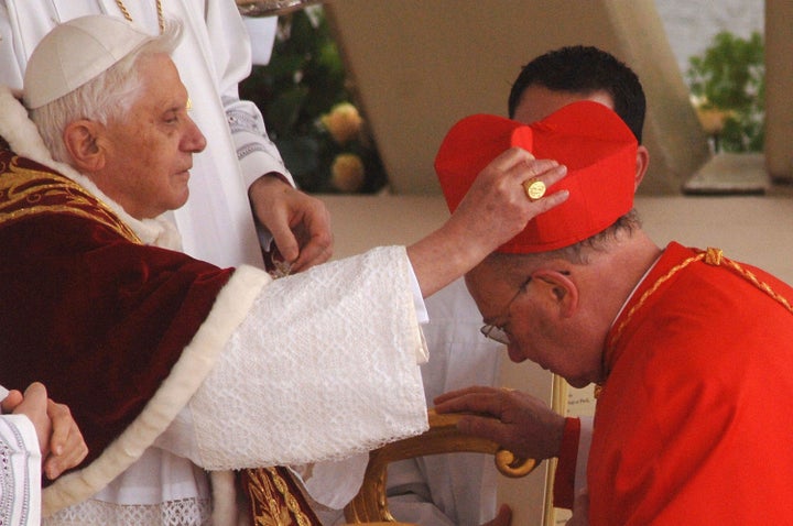 New cardinal William Joseph Levada receives the biretta cap from Pope Benedict XVI in Saint Peter's Square, March 24, 2006 in Vatican City. The Pontiff installed 15 new cardinals during the Consistory ceremony. 