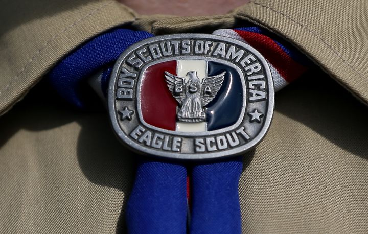 An Eagle Scout displays a badge. 