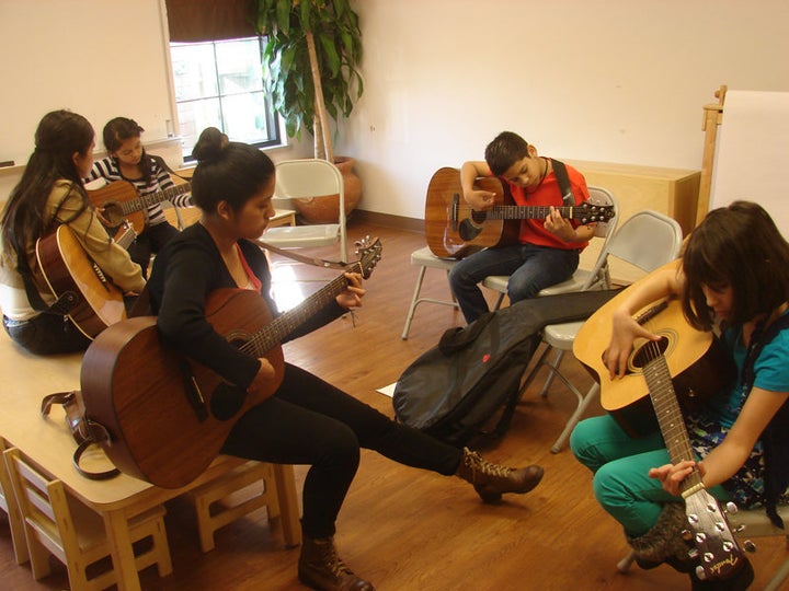 Adriana Campos, front left, is a youth band member at Christ’s Foundry United Methodist Church in Dallas who teaches guitar there on Sunday afternoons. 