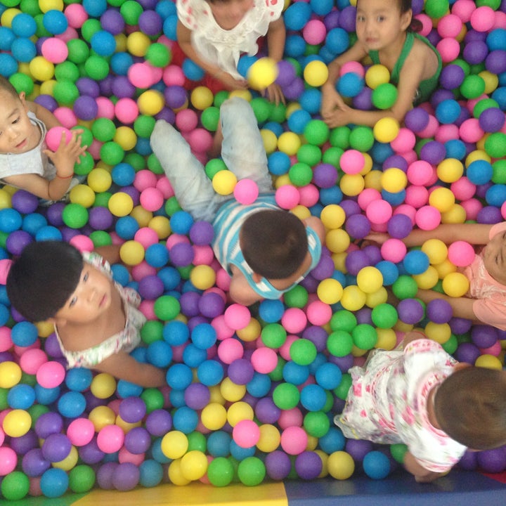 Children play at the first parenting training center opened by REAP in Danfeng County.