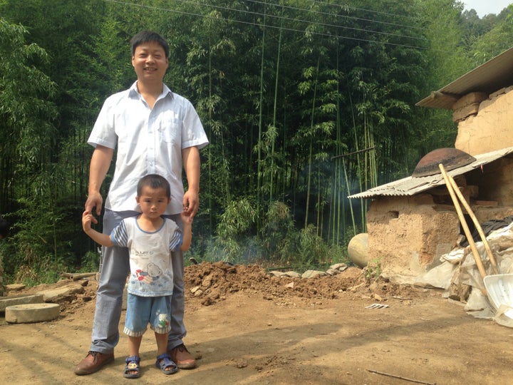 Family planning official Tang Hailan during a home visit for the REAP parenting training project.