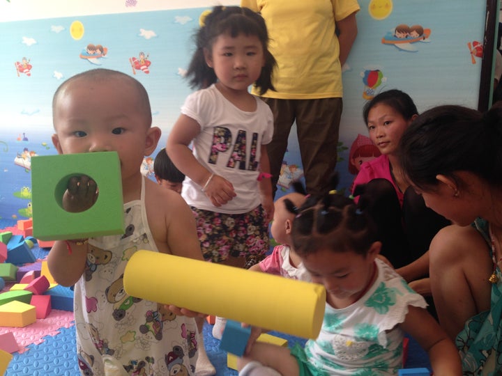 Children play at the first parenting training center REAP opened in Shaanxi Province.