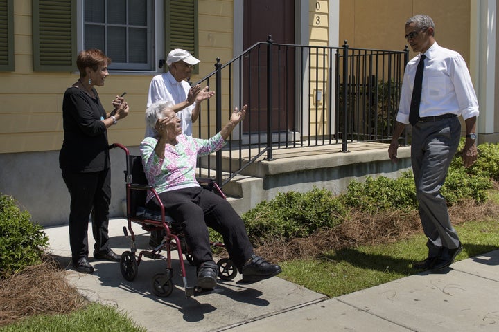 President Barack Obama walks towards residents during a tour of the Treme neighborhood August 27, 2015 in New Orleans, Louisiana. President Obama visited New Orleans Thursday to praise its people's 'extraordinary resilience,' 10 years after Hurricane Katrina ravaged the 'Big Easy' and shattered Americans' confidence in government.