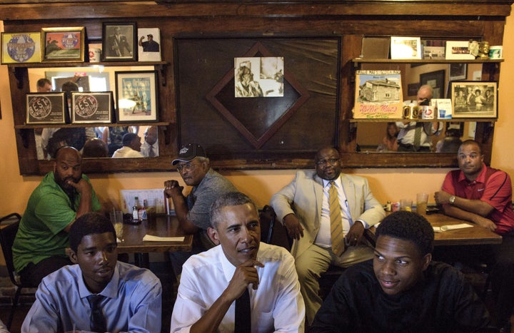 President Barack Obama waits for a lunch with residents at Willie Mae's Restaurant August 27, 2015 in New Orleans, Louisiana.