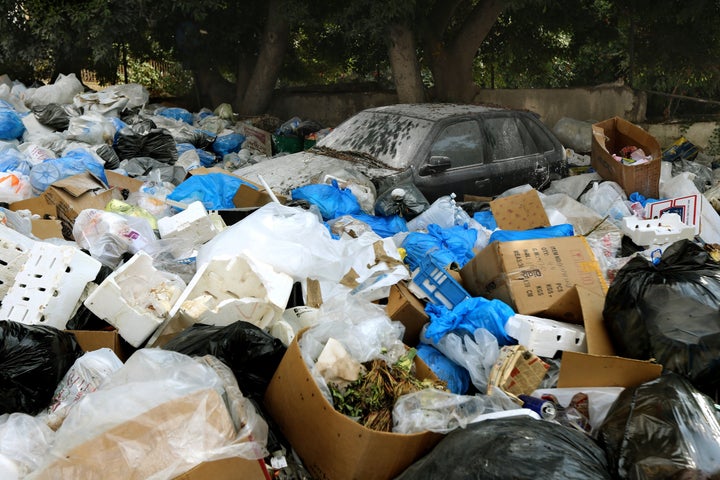 Large amounts of trash surround a car in Beirut, Lebanon, on Aug. 24, 2015.