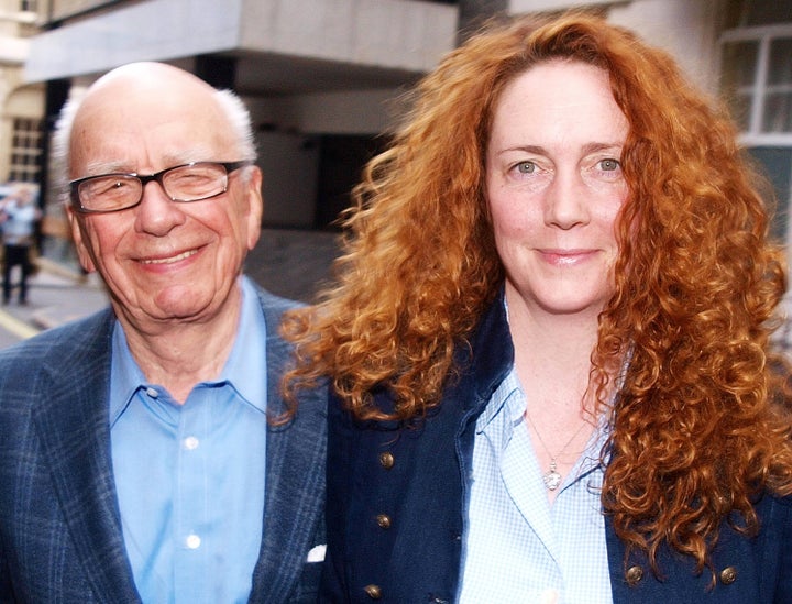 <p>Rebekah Brooks and Rupert Murdoch Chairman of News Corporation leave from his London residence in Britain on July 10, 2011.</p>