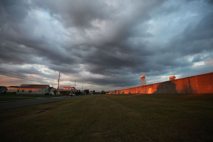The sun rises at the re-constructed levee wall along the Industrial Canal in the Lower Ninth Ward.