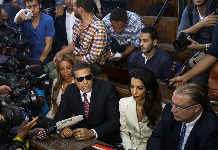 Canadian-Egyptian Al-Jazeera journalist Mohamed Fahmy (right 3), one of the three reporters sentenced to three year in jail b
